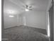 Bright, carpeted living room featuring neutral colors, modern lighting, and ample natural light at 200 E Southern Ave # 363, Tempe, AZ 85282
