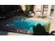 Community pool with clear blue water and mature landscaping around the apartment building at 200 E Southern Ave # 363, Tempe, AZ 85282