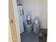 Utility closet with water heater, paint supplies, and concrete coating, providing storage solutions at 200 E Southern Ave # 363, Tempe, AZ 85282