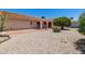 Backyard showing a covered patio, low maintenance landscaping, and mature citrus trees at 2005 Leisure World --, Mesa, AZ 85206