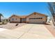 Charming single-story home featuring a terracotta roof, neutral stucco, and a well-maintained driveway at 2005 Leisure World --, Mesa, AZ 85206
