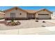 Charming single-story home with a terracotta roof, neutral stucco, and low-maintenance desert landscaping at 2005 Leisure World --, Mesa, AZ 85206