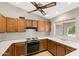 Bright kitchen with wood cabinets, white countertops, and laminate flooring at 2005 Leisure World --, Mesa, AZ 85206