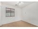 Empty bedroom with neutral tiling, a window, and a ceiling fan at 2025 S 83Rd Dr, Tolleson, AZ 85353