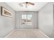 Neutral bedroom with tiled floor features natural light from the large window at 2025 S 83Rd Dr, Tolleson, AZ 85353