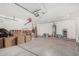 Spacious garage providing ample storage, featuring a water heater and convenient overhead door at 2025 S 83Rd Dr, Tolleson, AZ 85353