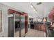 Functional kitchen featuring stainless steel refrigerator and ample countertop space at 2025 S 83Rd Dr, Tolleson, AZ 85353