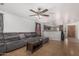 Spacious living room showcasing tile floors and convenient access to the kitchen at 2025 S 83Rd Dr, Tolleson, AZ 85353