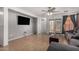 Comfortable living area features tile flooring and a ceiling fan at 2025 S 83Rd Dr, Tolleson, AZ 85353