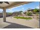 Backyard patio area showcasing desert landscaping, artificial turf, and mountain views at 20644 W Mariposa St, Buckeye, AZ 85396