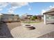 Backyard patio area showcasing desert landscaping, artificial turf, and mountain views at 20644 W Mariposa St, Buckeye, AZ 85396