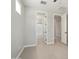Bedroom view with multiple doorways, tile flooring, and an entrance to the ensuite bathroom at 20644 W Mariposa St, Buckeye, AZ 85396