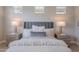 Beautiful bedroom features plush bedding, matching nightstands, and elegant lamps at 20644 W Mariposa St, Buckeye, AZ 85396