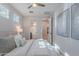 Relaxing bedroom features three windows, access to the bathroom, and stylish decor at 20644 W Mariposa St, Buckeye, AZ 85396