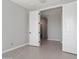 Spacious, empty bedroom featuring tile floors, base trim and a walk-in closet at 20644 W Mariposa St, Buckeye, AZ 85396