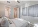 Bright bedroom offers connecting bathroom, neutral decor, and stylish artwork at 20644 W Mariposa St, Buckeye, AZ 85396