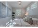 Comfortable bedroom with large window, stylish decor, and serene ambiance at 20644 W Mariposa St, Buckeye, AZ 85396