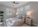 Bright bedroom featuring a neutral color palette, plush bedding, and ample natural light at 20644 W Mariposa St, Buckeye, AZ 85396