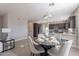 Open-concept dining area with modern decor adjacent to kitchen at 20644 W Mariposa St, Buckeye, AZ 85396