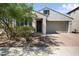 Inviting single-Gathering home with a desert-landscaped front yard and a brick-paved driveway at 20644 W Mariposa St, Buckeye, AZ 85396