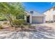 Charming single-story home featuring a two-car garage, low-maintenance landscaping, and a neutral color palette at 20644 W Mariposa St, Buckeye, AZ 85396