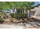 Charming, single-story house featuring desert landscaping with mature trees for added curb appeal at 20644 W Mariposa St, Buckeye, AZ 85396
