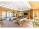 Entertaining game room featuring pool tables, comfortable seating, and a relaxing atmosphere at 20644 W Mariposa St, Buckeye, AZ 85396