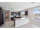 Well-lit kitchen boasts granite countertops, stainless steel appliances, and ample cabinet space at 20644 W Mariposa St, Buckeye, AZ 85396