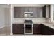 Updated kitchen features stainless steel appliances and granite countertops at 20644 W Mariposa St, Buckeye, AZ 85396