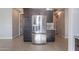 Kitchen featuring a stainless steel refrigerator with cabinets surrounding at 20644 W Mariposa St, Buckeye, AZ 85396