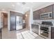 Modern kitchen featuring stainless steel appliances and ample cabinet space with great lighting at 20644 W Mariposa St, Buckeye, AZ 85396