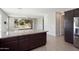 Modern kitchen island with stainless steel appliances with sliding glass doors leading to backyard at 20644 W Mariposa St, Buckeye, AZ 85396