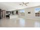 Expansive living area featuring dark cabinets, neutral countertops, and lots of natural light at 20644 W Mariposa St, Buckeye, AZ 85396