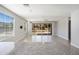 Light-filled living room with tile floors, a ceiling fan, and a sliding glass door that leads to backyard at 20644 W Mariposa St, Buckeye, AZ 85396
