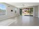 Light-filled living room with tile floors, a ceiling fan, and a sliding glass door that leads to backyard at 20644 W Mariposa St, Buckeye, AZ 85396