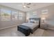 A serene main bedroom features neutral tones, lots of natural light, and a cozy upholstered bench at 20644 W Mariposa St, Buckeye, AZ 85396
