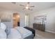 View from the bed to the ensuite and bedroom closet, dresser with decor, and neutral-toned artwork at 20644 W Mariposa St, Buckeye, AZ 85396