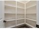 Walk-in pantry with lots of built-in shelves for organization and storage at 20644 W Mariposa St, Buckeye, AZ 85396