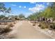 Scenic walking path through the community with lush desert landscaping at 20644 W Mariposa St, Buckeye, AZ 85396