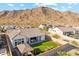 Scenic backyard with artificial turf, outdoor seating, and desert views of a single Gathering home at 21391 W Mariposa St, Buckeye, AZ 85396