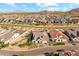 Spacious, landscaped property showcasing the neighborhood, mountain views, and lush greenery in the backyard at 21391 W Mariposa St, Buckeye, AZ 85396