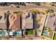 Overhead view of home featuring a pool, artificial turf, desert landscaping, and scenic neighborhood views at 21391 W Mariposa St, Buckeye, AZ 85396