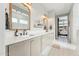 Bathroom featuring double vanity, neutral color palette, and herringbone floor at 21391 W Mariposa St, Buckeye, AZ 85396