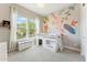 Charming bedroom features bunk bed, neutral colors, window, and decorative wall art at 21391 W Mariposa St, Buckeye, AZ 85396