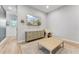 Bright bonus room features modern flooring, grey walls, TV, and stylish furniture at 21391 W Mariposa St, Buckeye, AZ 85396