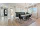 Chic dining room with a modern table setting, stylish lighting, and elegant decor, perfect for gatherings and everyday meals at 21391 W Mariposa St, Buckeye, AZ 85396