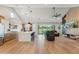 Open floor plan showcases kitchen with large island and living room with entertainment center at 21391 W Mariposa St, Buckeye, AZ 85396