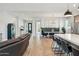Spacious living area features wood-look floors and flows into the dining area at 21391 W Mariposa St, Buckeye, AZ 85396