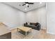 Casual living room features a comfortable sofa and a light wood coffee table at 21391 W Mariposa St, Buckeye, AZ 85396