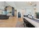 Bright living room features hardwood floors, modern furniture, and eye-catching entertainment center at 21391 W Mariposa St, Buckeye, AZ 85396